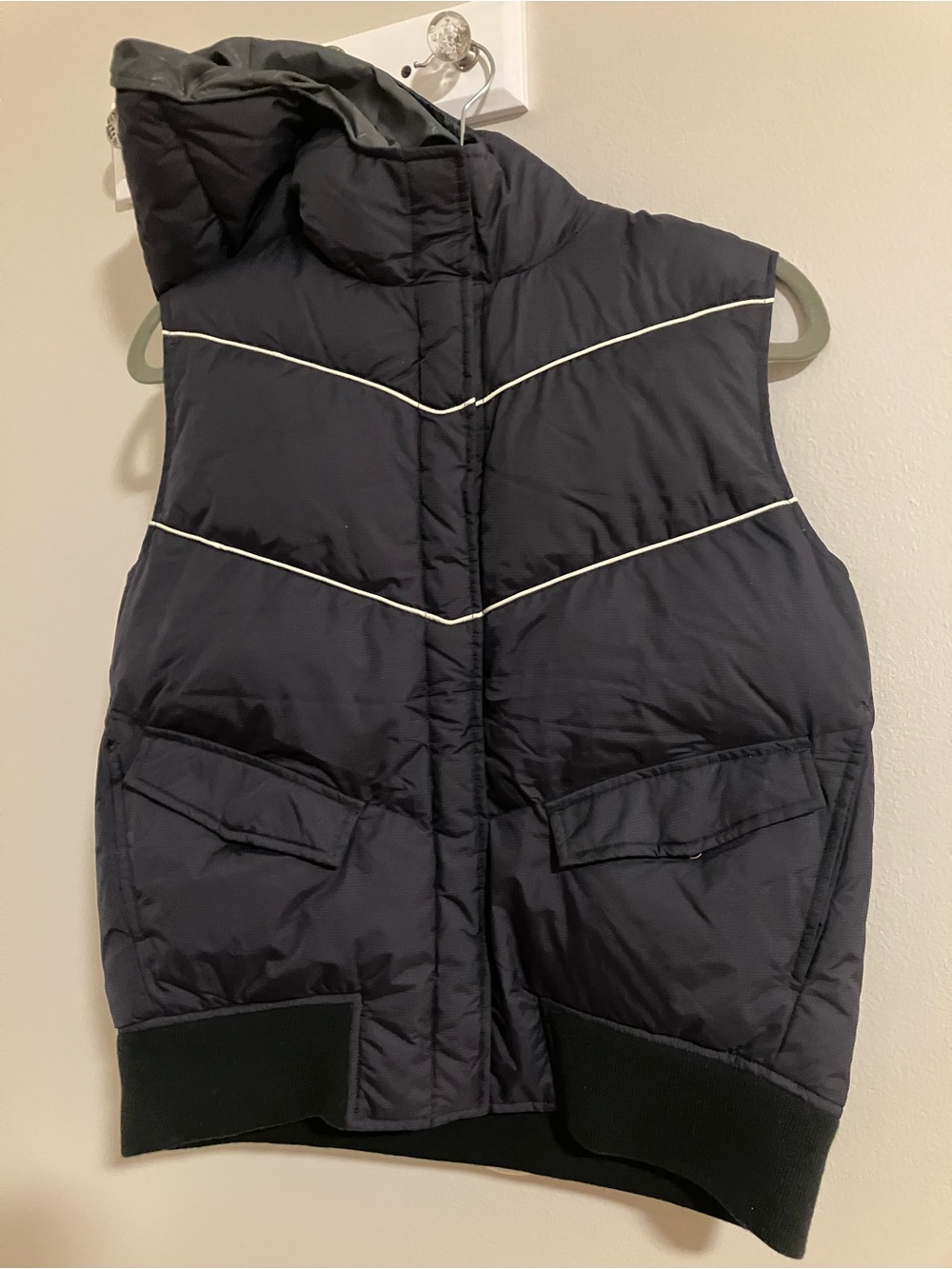 Eastern Mountain Sports navy puffer vest with hood.